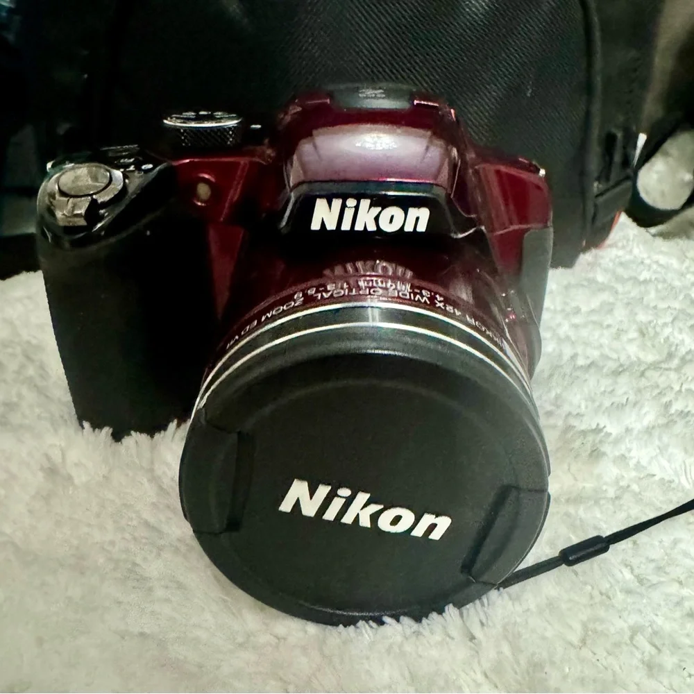 Nikon Red Digital Camera with Zoom Lens and Stylish Design